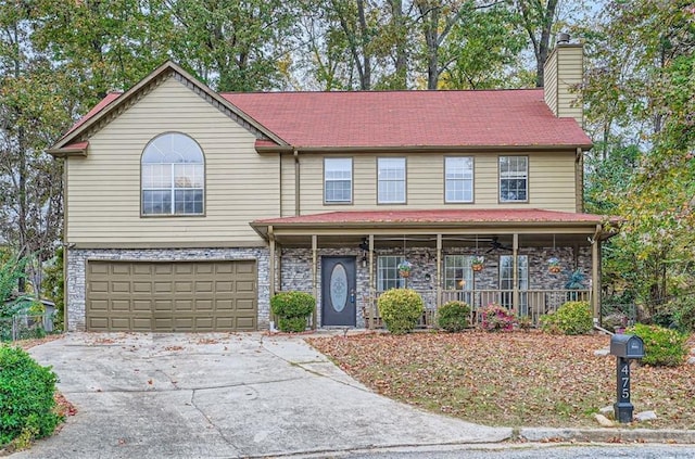 view of front of property with a garage and a porch