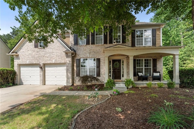 5828 Paliser Trce, Sugar Hill, GA 30518 - view of front of home featuring concrete driveway, a porch, brick siding, and a garage