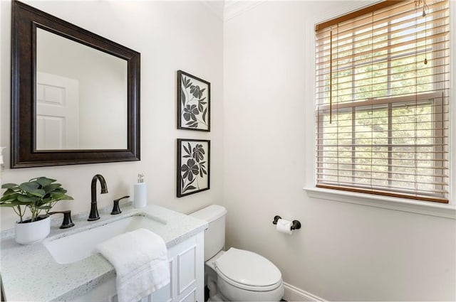 5828 Paliser Trce, Sugar Hill, GA 30518 - half bath featuring vanity, toilet, ornamental molding, and baseboards