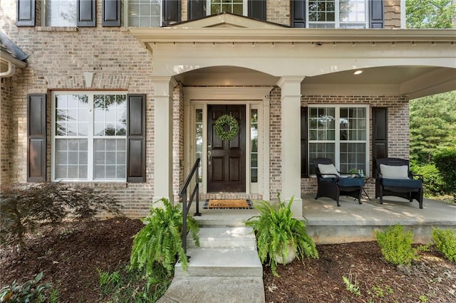 5828 Paliser Trce, Sugar Hill, GA 30518 - property entrance with brick siding and a porch