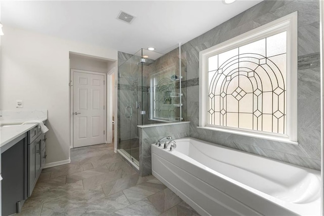5828 Paliser Trce, Sugar Hill, GA 30518 - bathroom featuring a bath, vanity, a shower stall, baseboards, and marble look tile flooring