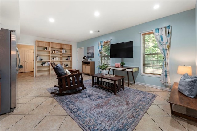 5828 Paliser Trce, Sugar Hill, GA 30518 - living area with light tile patterned floors, recessed lighting, and baseboards