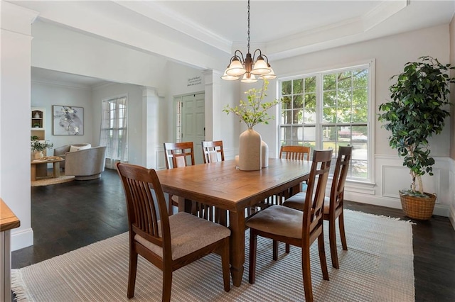 5828 Paliser Trce, Sugar Hill, GA 30518 - dining area featuring ornamental molding, healthy amount of natural light, wood finished floors, a chandelier, and a wainscoted wall