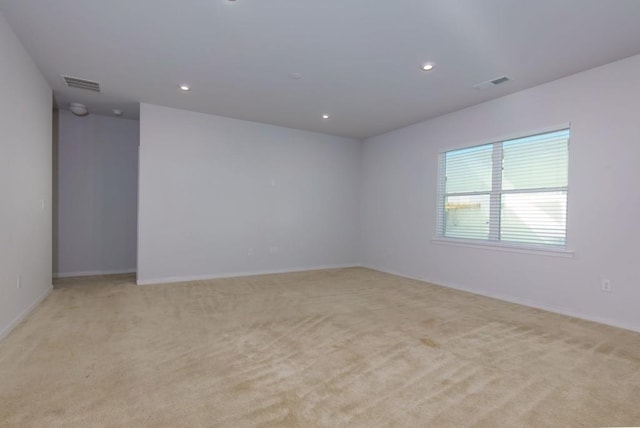 spare room with light carpet