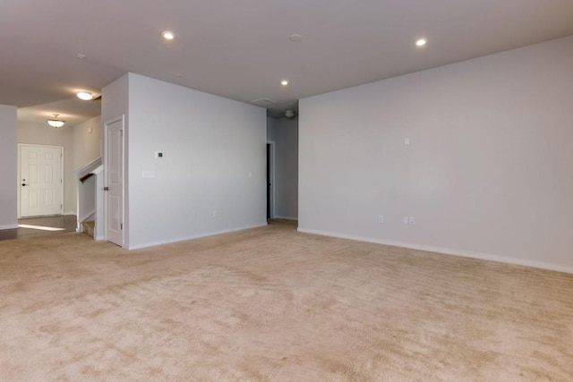 empty room with light colored carpet