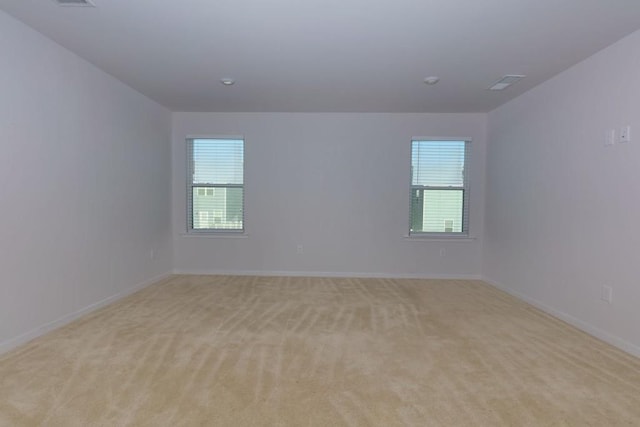 empty room with light colored carpet