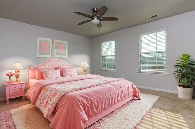 bedroom with ceiling fan and carpet flooring