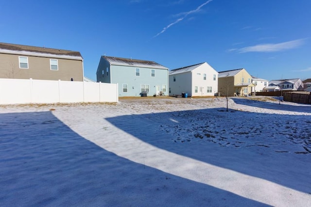 view of yard layered in snow