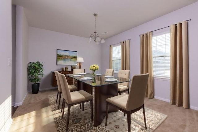 carpeted dining area featuring a chandelier