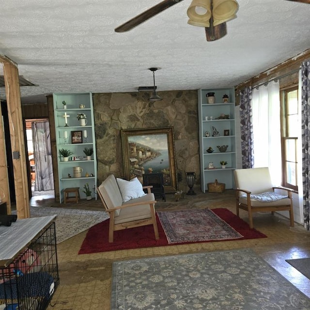 80 Two Run Creek Trl NW, Cartersville, GA 30120 - living area with a textured ceiling, tile patterned floors, built in features, and ceiling fan