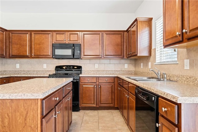 kitchen featuring light countertops, a sink, backsplash, and black appliances