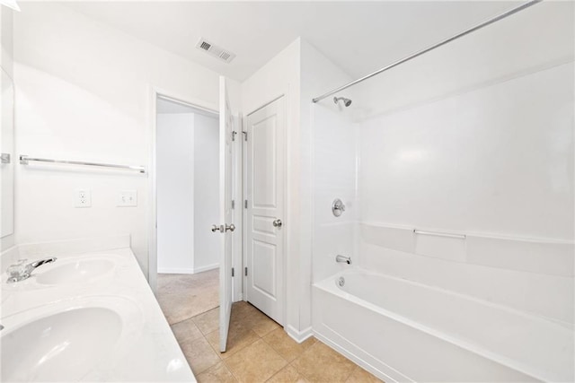 full bath featuring double vanity, shower / bathing tub combination, a sink, and visible vents