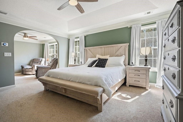 537 Autumn Ridge Dr, Canton, GA 30115 - bedroom with ornamental molding, light colored carpet, arched walkways, a ceiling fan, and baseboards