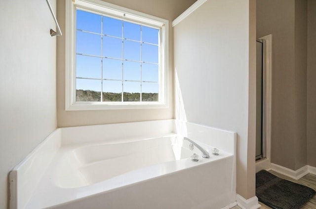 537 Autumn Ridge Dr, Canton, GA 30115 - full bathroom featuring a bath, a shower stall, and baseboards