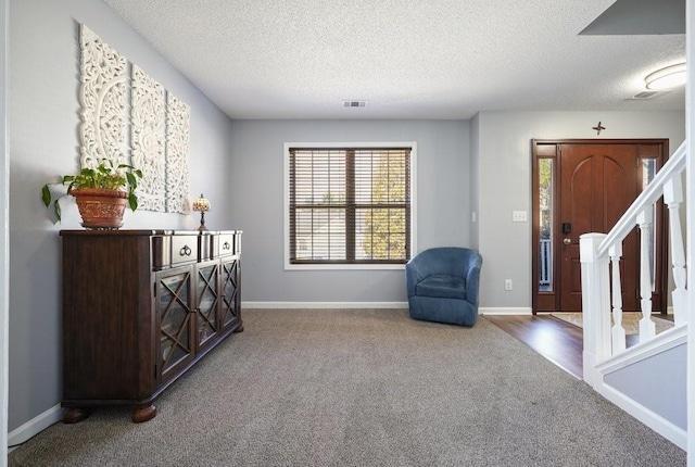 537 Autumn Ridge Dr, Canton, GA 30115 - sitting room featuring carpet flooring, stairs, a textured ceiling, and baseboards