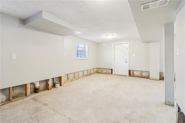 6071 Cristie Dr, Ellenwood, GA 30294 - below grade area with a textured ceiling