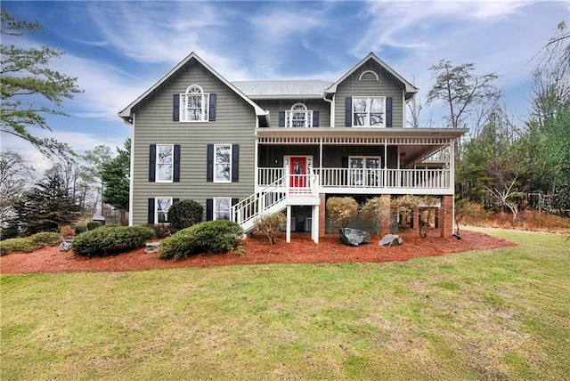 view of front of house with a front yard and covered porch