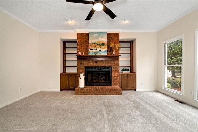 unfurnished living room with crown molding, a brick fireplace, light colored carpet, and a textured ceiling