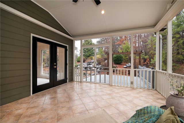 unfurnished sunroom featuring french doors, ceiling fan, and lofted ceiling