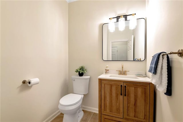 bathroom with vanity, toilet, and tile patterned flooring