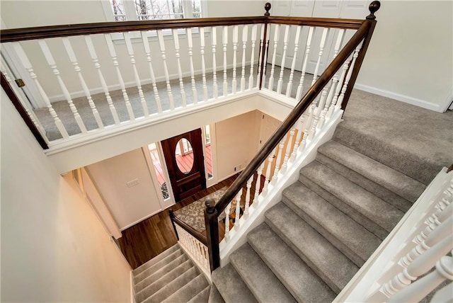 staircase featuring wood-type flooring