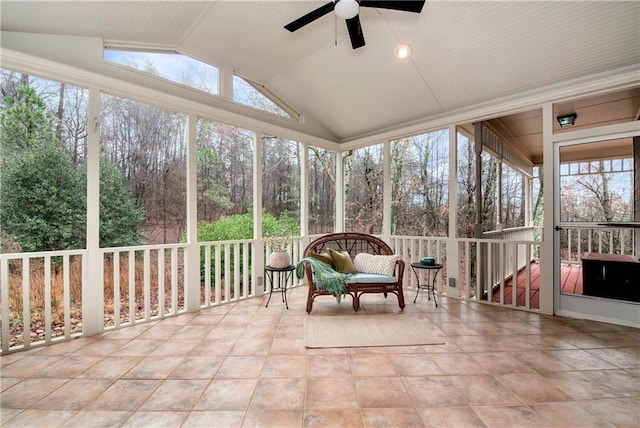 sunroom featuring a wealth of natural light, ceiling fan, and vaulted ceiling