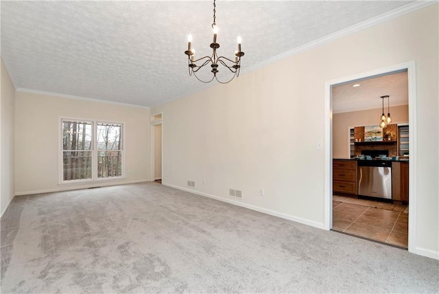 unfurnished room featuring a chandelier, light carpet, and a textured ceiling