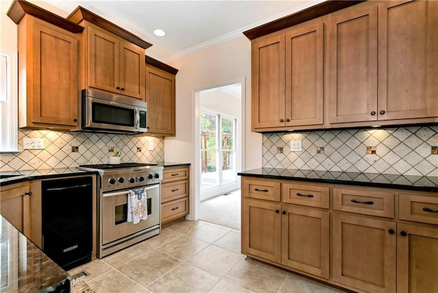 kitchen with crown molding, stainless steel appliances, light tile patterned flooring, and backsplash