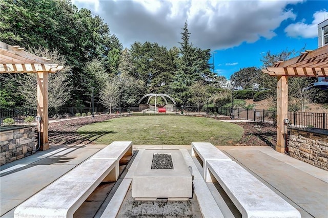 795 Hammond Dr Unit 813, Sandy Springs, GA 30328 - fenced backyard featuring a pergola, a patio area, and an outdoor fire pit