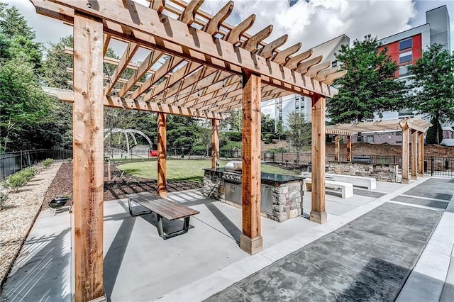 795 Hammond Dr Unit 813, Sandy Springs, GA 30328 - fenced backyard featuring a pergola, a patio area, and exterior kitchen