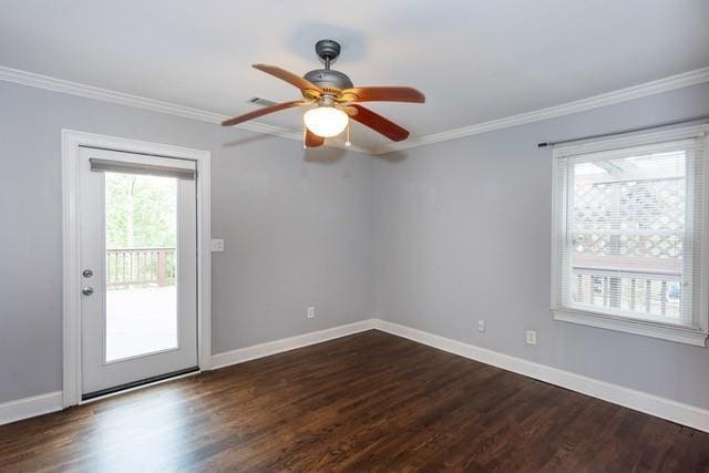 empty room with ceiling fan, dark wood-type flooring, baseboards, and ornamental molding