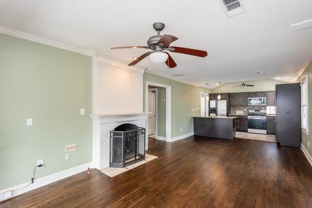 unfurnished living room featuring a fireplace with flush hearth, dark wood-style floors, and ornamental molding