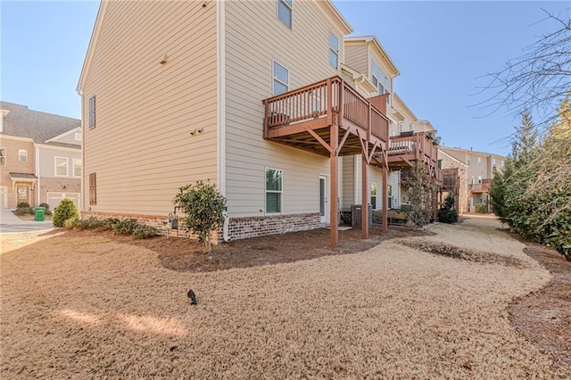 back of house featuring a deck