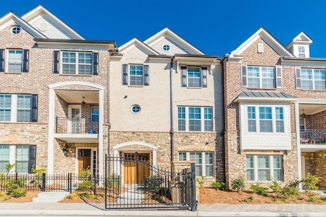1435 Druid Mnr, Atlanta, GA 30329 - townhome / multi-family property featuring stone siding and fence