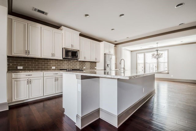 1435 Druid Mnr, Atlanta, GA 30329 - kitchen with stainless steel appliances, a chandelier, a large island, backsplash, and a sink
