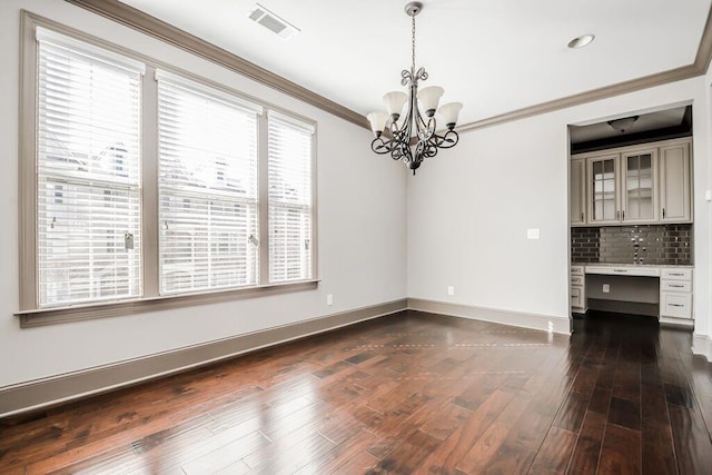 1435 Druid Mnr, Atlanta, GA 30329 - unfurnished dining area featuring a chandelier, crown molding, baseboards, dark wood-style floors, and recessed lighting