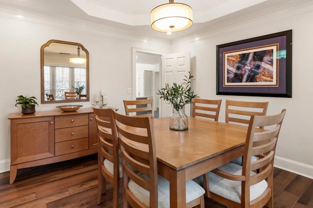 dining space featuring crown molding and dark hardwood / wood-style flooring