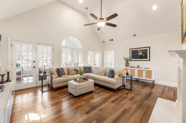 living room with dark hardwood / wood-style flooring, high vaulted ceiling, french doors, and ceiling fan