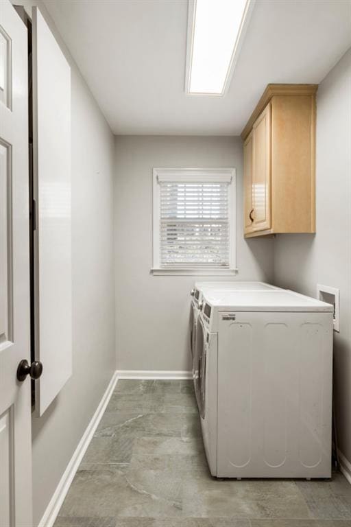 laundry area with cabinets and washer and clothes dryer