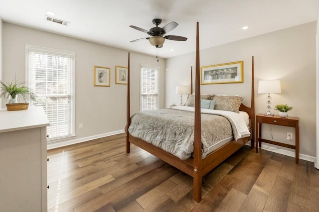 bedroom featuring ceiling fan and dark hardwood / wood-style flooring