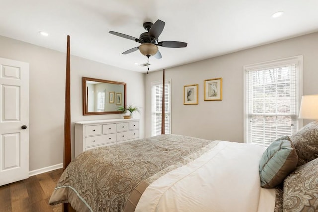 bedroom with ceiling fan and dark hardwood / wood-style floors