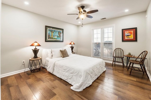 bedroom with wood-type flooring and ceiling fan