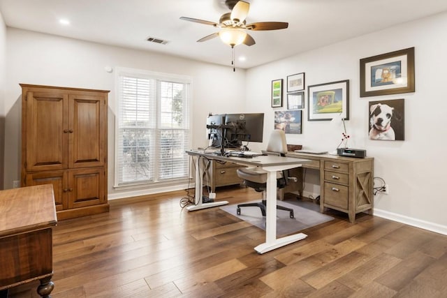 home office featuring wood-type flooring and ceiling fan