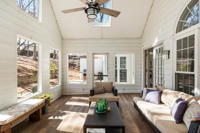 sunroom / solarium with ceiling fan, lofted ceiling, and plenty of natural light