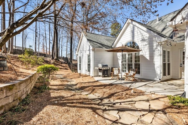 rear view of property featuring a patio area