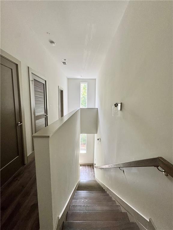 1153 Reynolds Square Ln # 16, Atlanta, GA 30307 - staircase featuring wood finished floors and baseboards