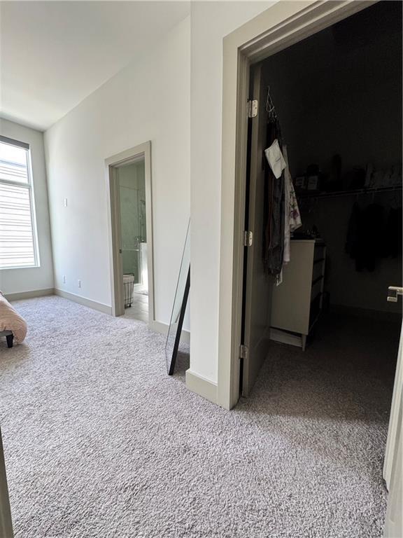 1153 Reynolds Square Ln # 16, Atlanta, GA 30307 - corridor featuring carpet flooring and baseboards