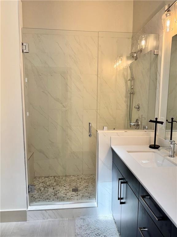 1153 Reynolds Square Ln # 16, Atlanta, GA 30307 - full bath with a marble finish shower, vanity, and baseboards