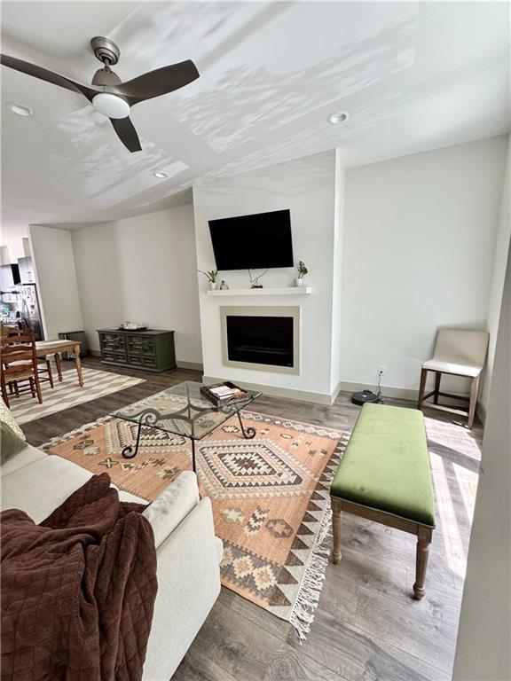 1153 Reynolds Square Ln # 16, Atlanta, GA 30307 - living area featuring ceiling fan, recessed lighting, a fireplace, wood finished floors, and baseboards