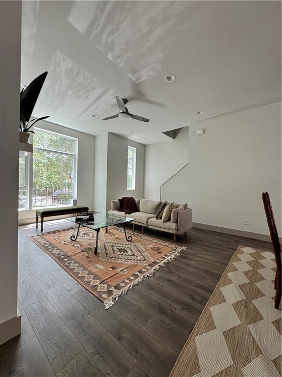 1153 Reynolds Square Ln # 16, Atlanta, GA 30307 - living area featuring dark wood-type flooring, a ceiling fan, and baseboards